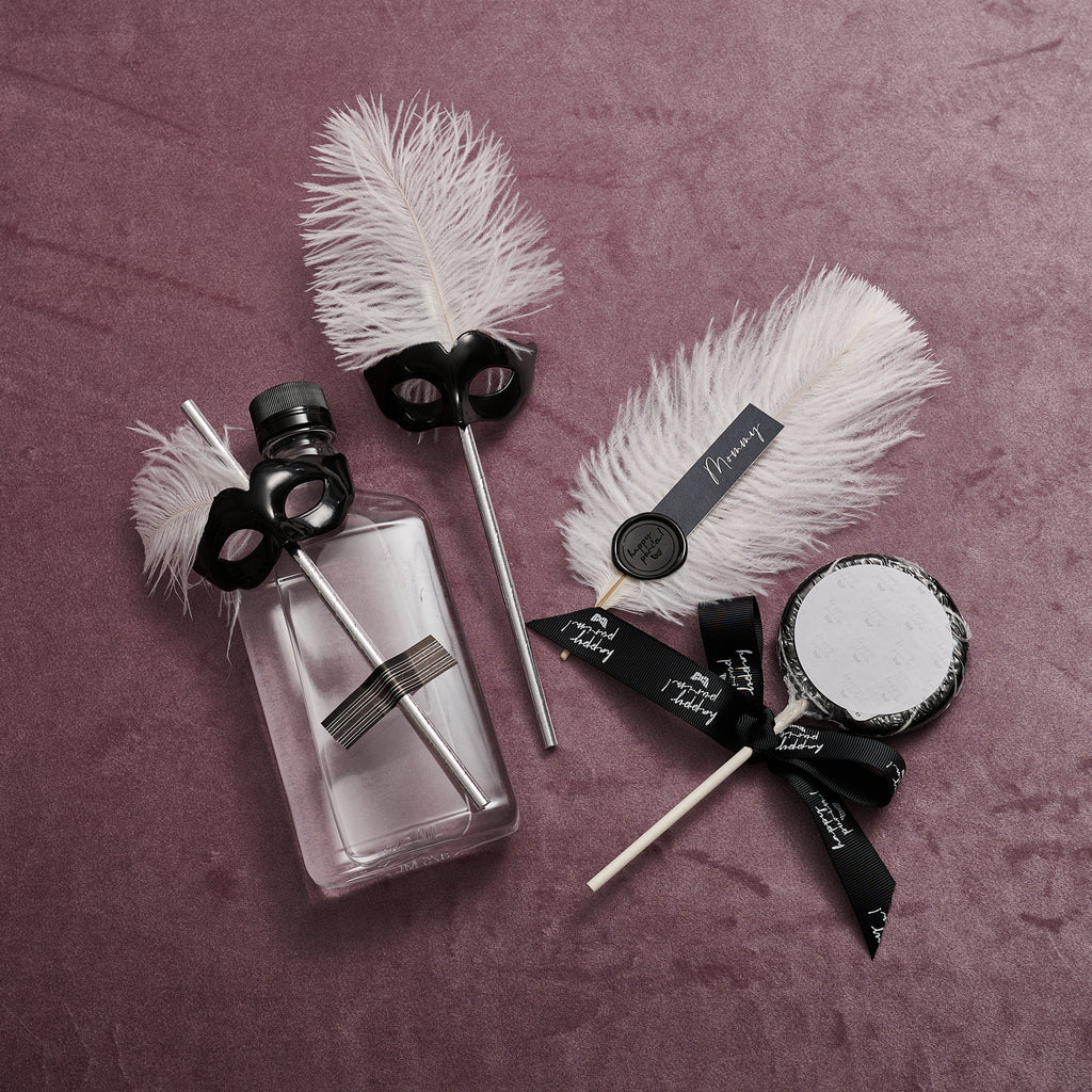 Feathery place cards with Purim wax seal